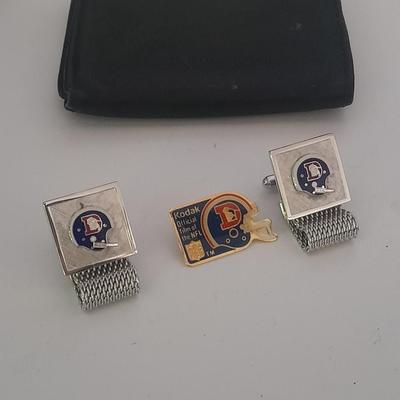 Denver Bronco's cuff links, Bronco's Kodak official film of NFL hat pin, and a black leather wallet