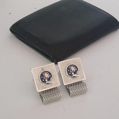 Denver Bronco's cuff links, Bronco's Kodak official film of NFL hat pin, and a black leather wallet