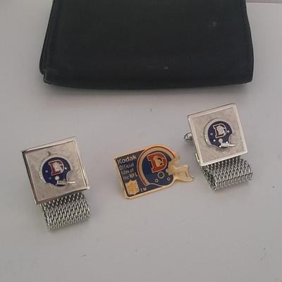 Denver Bronco's cuff links, Bronco's Kodak official film of NFL hat pin, and a black leather wallet