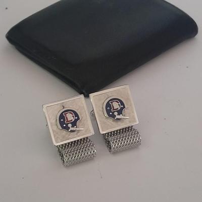 Denver Bronco's cuff links, Bronco's Kodak official film of NFL hat pin, and a black leather wallet