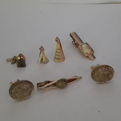 Tour Fossil'd Marked Cuff links, two tie clips, one marked Swank and shell charms.