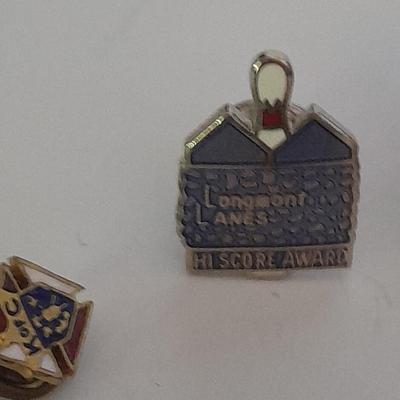 Hat pins, Desert 91 shield, Amway award, Bowling score award, K of C Knights of Columbus