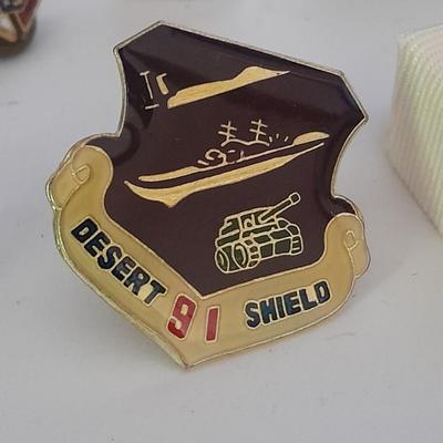 Hat pins, Desert 91 shield, Amway award, Bowling score award, K of C Knights of Columbus
