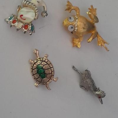 Four Fun and fancy hat pins, Roadrunner, Turtle, Frog, and a Clown