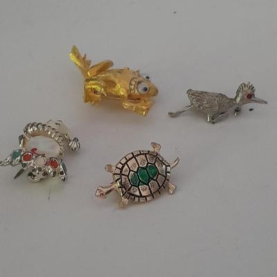 Four Fun and fancy hat pins, Roadrunner, Turtle, Frog, and a Clown