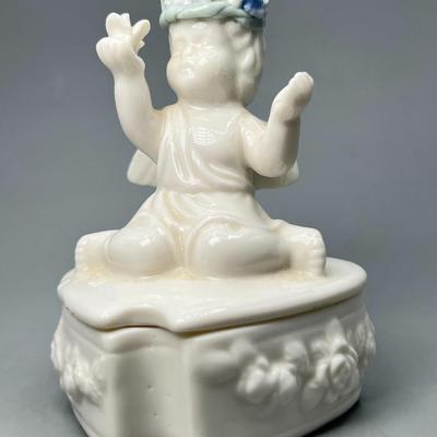 Small Heart Shaped Porcelain Trinket with Angel Cherub Sitting On Top Wearing Flower Crown