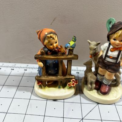 2 Hummel Figurines; Girl with Blue Bird and Boy with goats