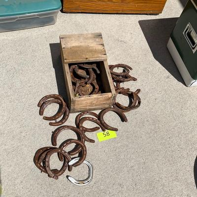 Wood Box full of horse shoes
