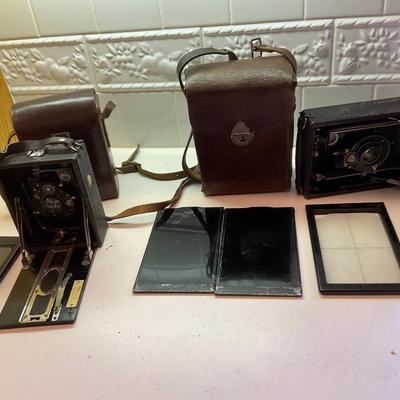 Two antique cameras.