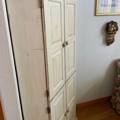 Corner Cabinet with shelves.