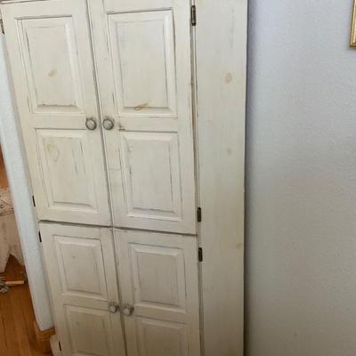 Corner Cabinet with shelves.
