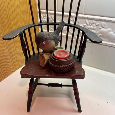 Doll chair and candle.