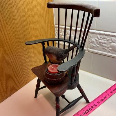 Doll chair and candle.