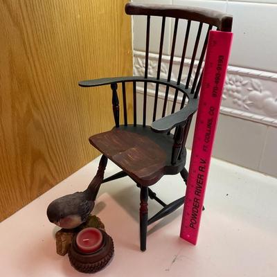 Doll chair and candle.