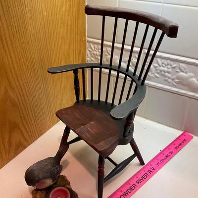 Doll chair and candle.