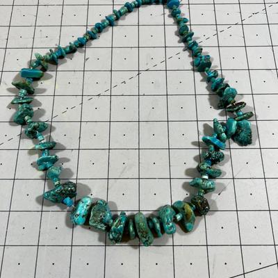 String of Turquois Beads on Thread 