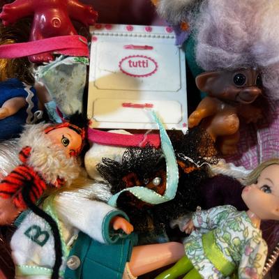 Polly Pockets, Troll Dolls in round Vinal Case. 