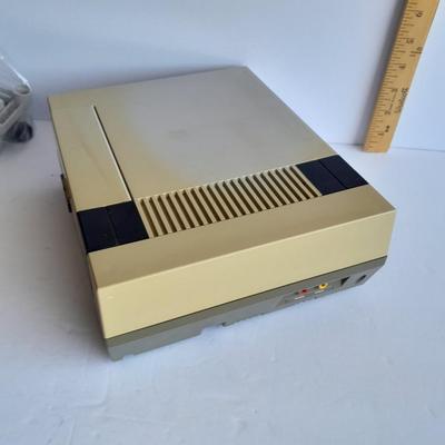 Vintage Nintendo Entertainment center with Eight Games, Rob Robot, Gun, AND MORE