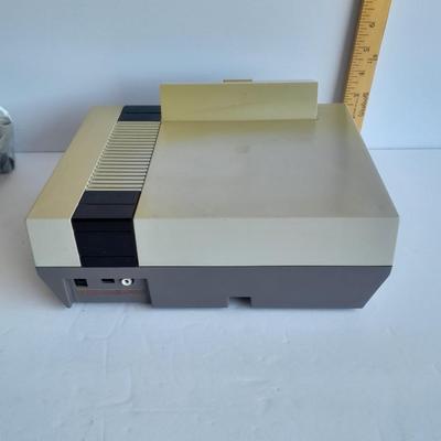 Vintage Nintendo Entertainment center with Eight Games, Rob Robot, Gun, AND MORE
