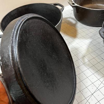 Last of the Cast Iron Lot: 2 Dutch, 1 Deep Skillet and 1 Random Lid. 