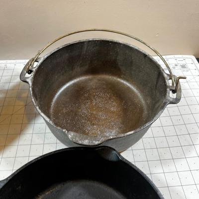 Last of the Cast Iron Lot: 2 Dutch, 1 Deep Skillet and 1 Random Lid. 