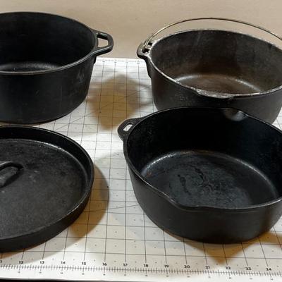 Last of the Cast Iron Lot: 2 Dutch, 1 Deep Skillet and 1 Random Lid. 