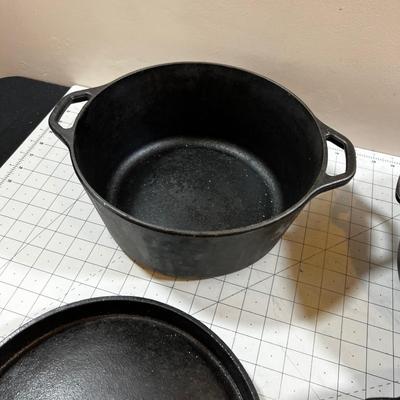 Last of the Cast Iron Lot: 2 Dutch, 1 Deep Skillet and 1 Random Lid. 