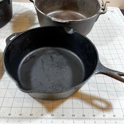 Last of the Cast Iron Lot: 2 Dutch, 1 Deep Skillet and 1 Random Lid. 