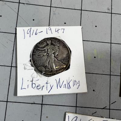 3 half Dollars: 1943 Walking Liberty, 1960 Franklin and 1976 Kennedy