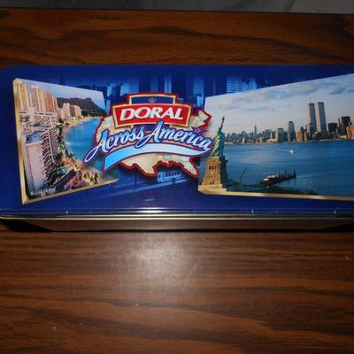 4 MOVIES ON DVD AND 2 DORAL HINGED TINS