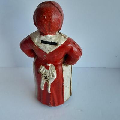 Cast Iron Mammy coin bank with porcelain figures, and metal bell