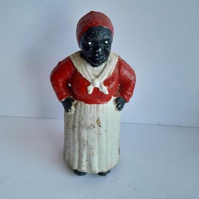 Cast Iron Mammy coin bank with porcelain figures, and metal bell