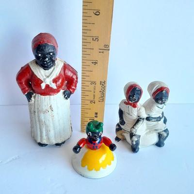 Cast Iron Mammy coin bank with porcelain figures, and metal bell