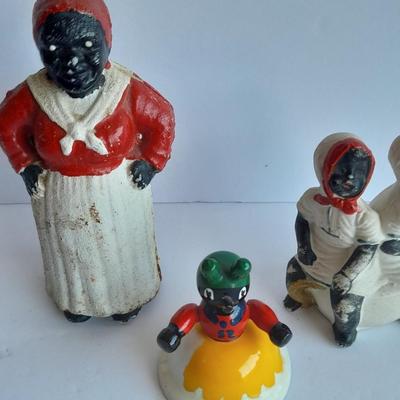 Cast Iron Mammy coin bank with porcelain figures, and metal bell