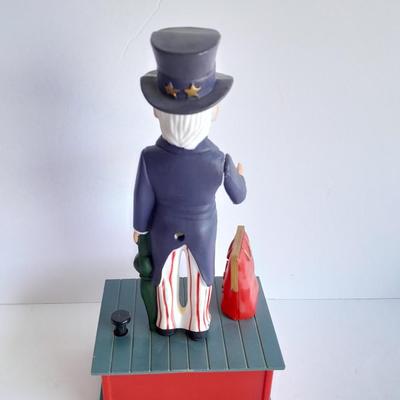 Uncle Sam coin bank and wooden coin bank with movement