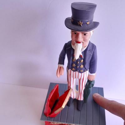 Uncle Sam coin bank and wooden coin bank with movement