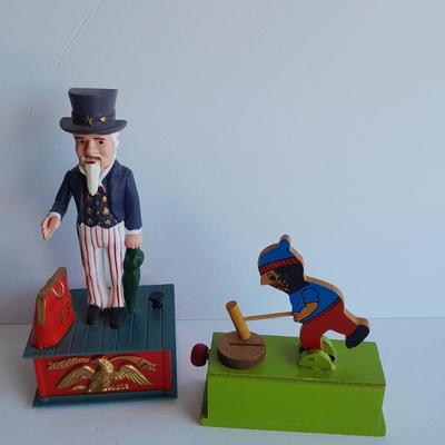 Uncle Sam coin bank and wooden coin bank with movement