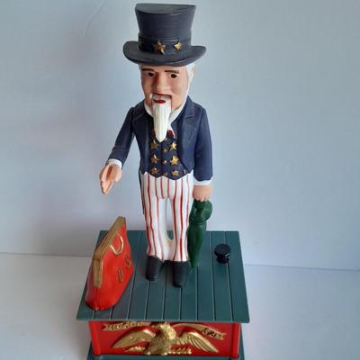 Uncle Sam coin bank and wooden coin bank with movement