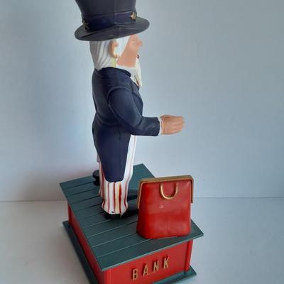 Uncle Sam coin bank and wooden coin bank with movement