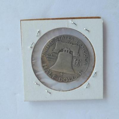 Four Franklin Half Dollar coins 1952P, 1954S, 1962D, and 1963D