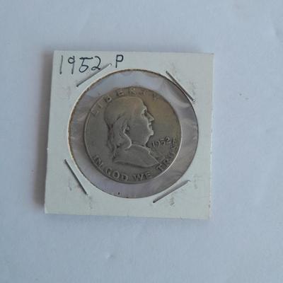 Four Franklin Half Dollar coins 1952P, 1954S, 1962D, and 1963D