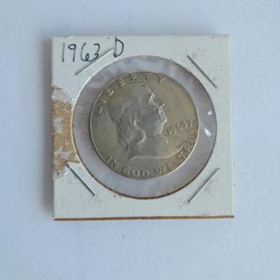 Four Franklin Half Dollar coins 1952P, 1954S, 1962D, and 1963D