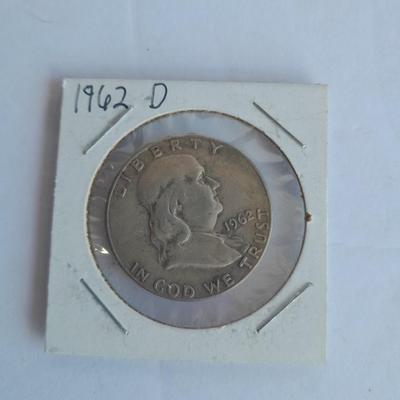 Four Franklin Half Dollar coins 1952P, 1954S, 1962D, and 1963D