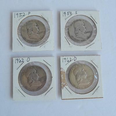 Four Franklin Half Dollar coins 1952P, 1954S, 1962D, and 1963D