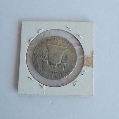 Four Franklin Half Dollar coins 1952P, 1954S, 1962D, and 1963D