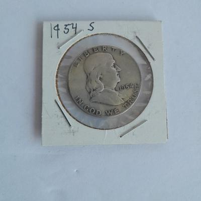 Four Franklin Half Dollar coins 1952P, 1954S, 1962D, and 1963D