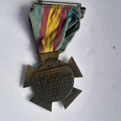 Two military badges and US hat pin
