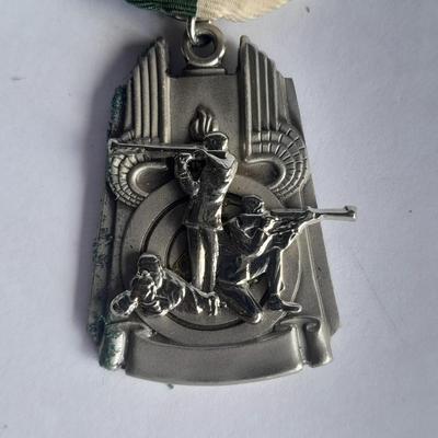 Two military badges and US hat pin