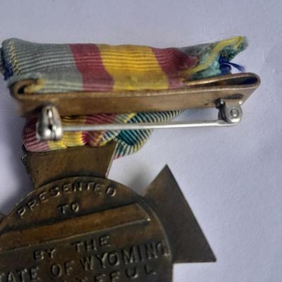Two military badges and US hat pin