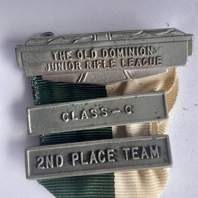 Two military badges and US hat pin